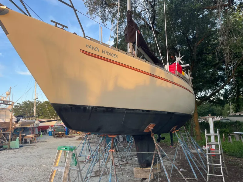 Slide: The Image of Sailboat "Haven Voyager" on stands, Maxi 35 CC, 1990 model, in a boatyard setting. - 22