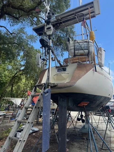 Slide: The Image of Sailboat Maxi 35 CC 1990 on stands, undergoing maintenance in a boatyard. - 24