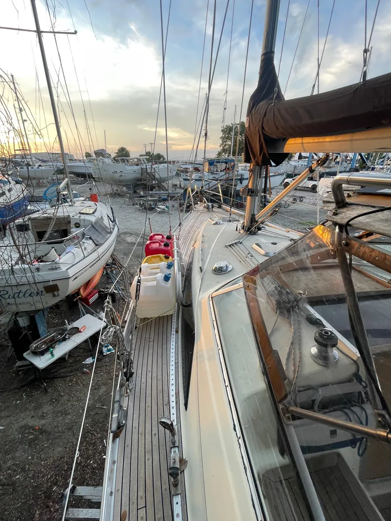Slide: The Image of Sailboat Maxi 35 CC 1990 docked at marina during sunset, surrounded by other boats. - 30