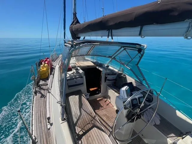 Slide: The Image of Sailing yacht Maxi 35 CC, 1990 model, cruising on calm blue waters. - 9