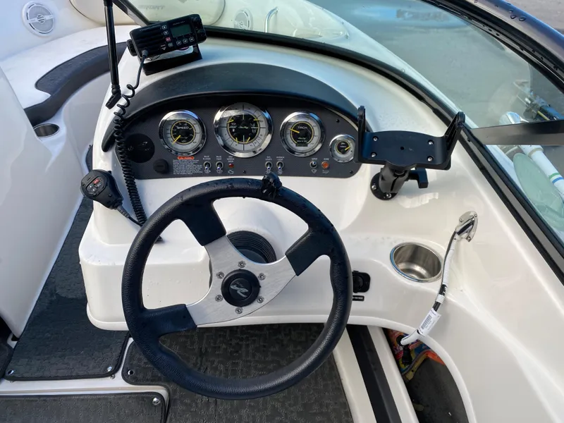 Slide: The Image of Steering console of a 2013 Sea Ray 205 Sport boat with gauges and controls. - 6