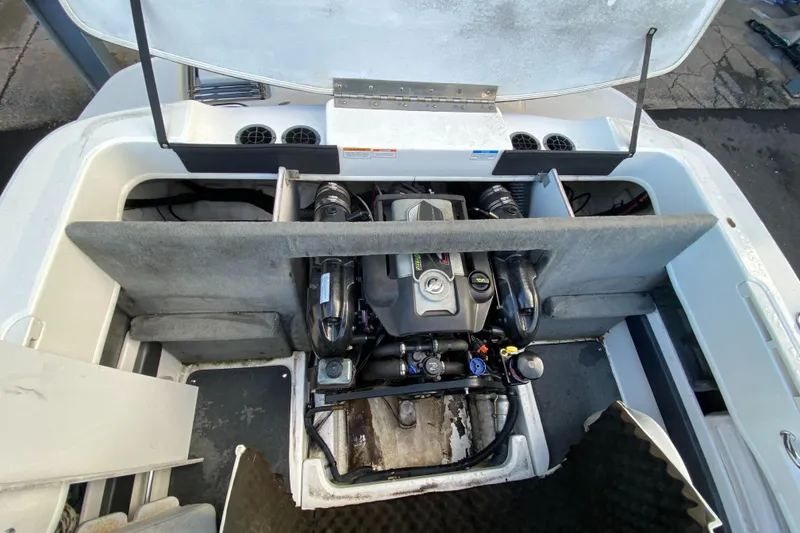 Slide: The Image of Engine compartment of a 2013 Sea Ray 205 Sport boat, showcasing internal components. - 9