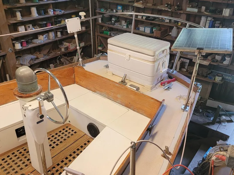 Slide: The Image of 1968 Cheoy Lee Herreshoff 31 Offshore Ketch cockpit with steering wheel, cooler, and solar panel. - 11
