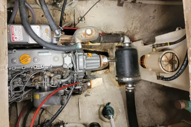 Slide: The Image of Engine compartment of a 1968 Cheoy Lee Herreshoff 31 Offshore Ketch, showing mechanical components. - 12