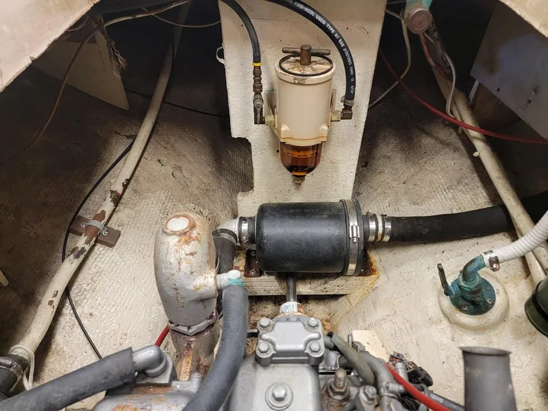 Slide: The Image of Engine compartment of a 1968 Cheoy Lee Herreshoff 31 Offshore Ketch, showing mechanical components. - 13