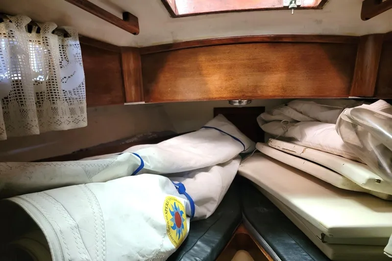 Slide: The Image of Interior of 1968 Cheoy Lee Herreshoff 31 Ketch with sails and wooden accents. - 30