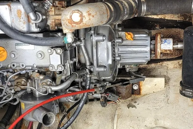 Slide: The Image of Engine compartment of a 1968 Cheoy Lee Herreshoff 31 Offshore Ketch, showing mechanical components. - 32