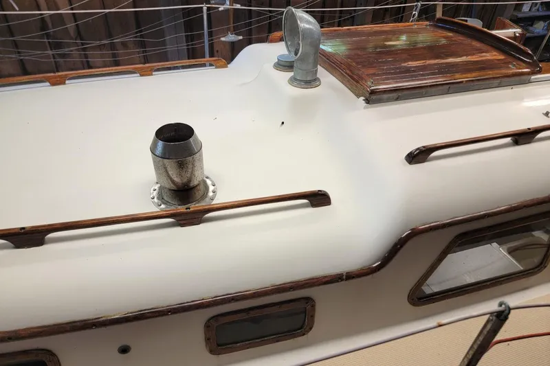 Slide: The Image of 1968 Cheoy Lee Herreshoff 31 Offshore Ketch deck with wooden accents and metal fittings. - 36