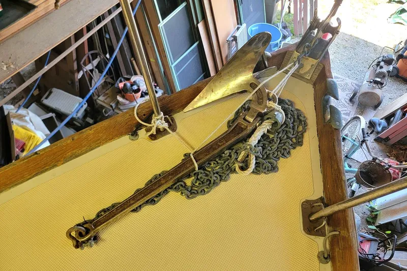 Slide: The Image of 1968 Cheoy Lee Herreshoff 31 Offshore Ketch anchor and chain on deck. - 38