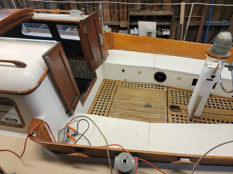 Slide: The Image of 1968 Cheoy Lee Herreshoff 31 Offshore Ketch cockpit with wooden details and open hatch. - 40