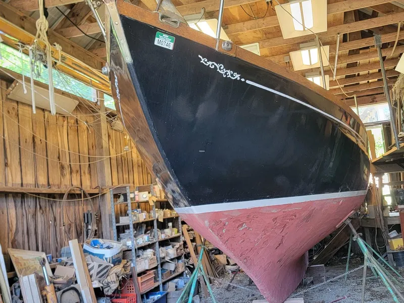 Slide: The Image of 1968 Cheoy Lee Herreshoff 31 Offshore Ketch in a wooden workshop. - 47