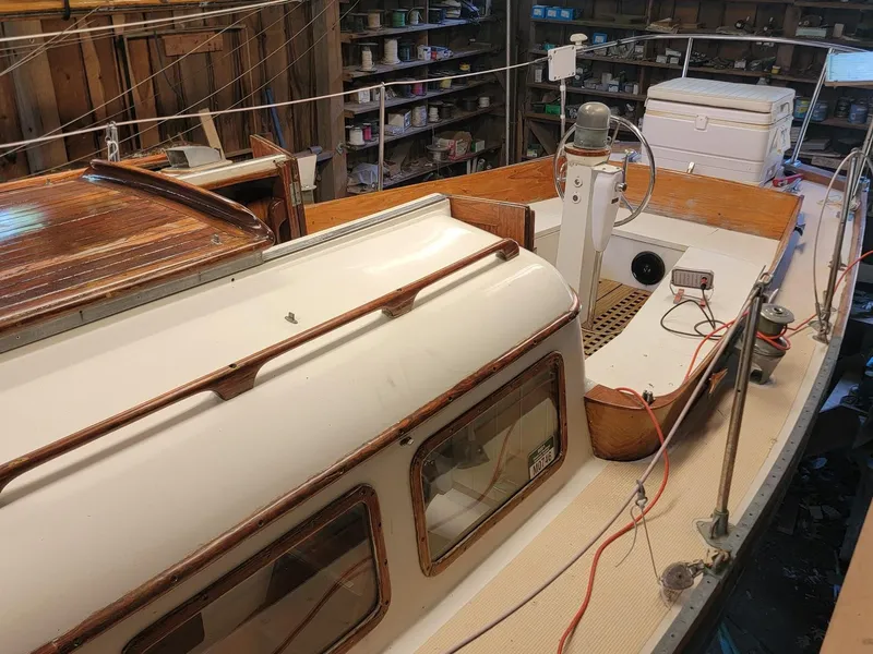 Slide: The Image of 1968 Cheoy Lee Herreshoff 31 Offshore Ketch in a workshop, showcasing deck and cabin details. - 9