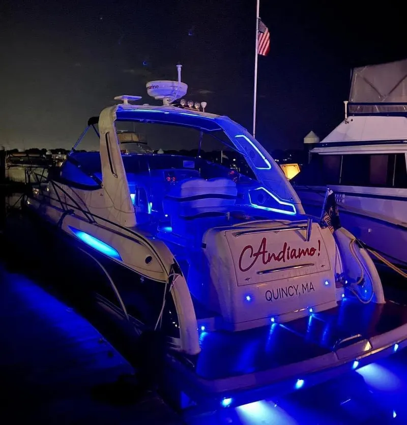 Slide: The Image of 2007 Formula 31 Cruiser yacht with blue LED lights docked at night. - 11