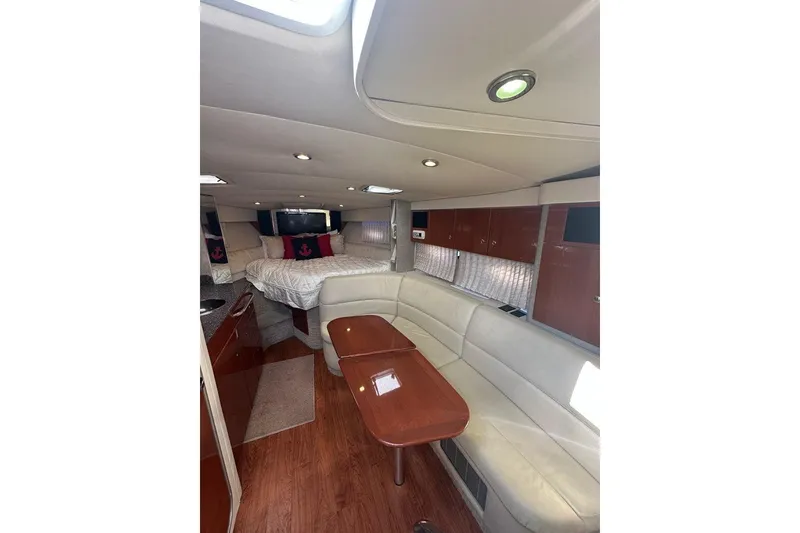 Slide: The Image of Luxurious interior of a 2007 Formula 31 Performance Cruiser with elegant seating and cozy bed. - 12