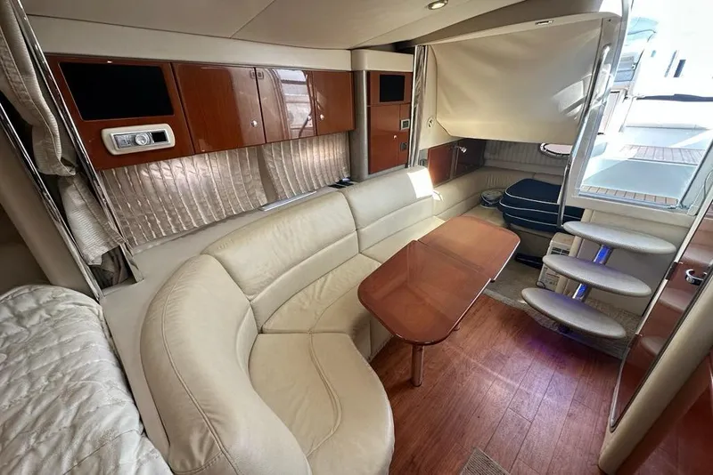Slide: The Image of Luxurious interior of a 2007 Formula 31 Performance Cruiser with elegant seating and wooden accents. - 13