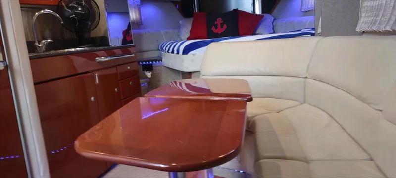Slide: The Image of Interior of 2007 Formula 31 Cruiser with cozy seating and nautical decor. - 15