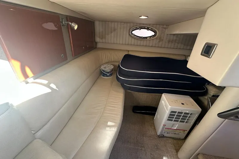 Slide: The Image of 2007 Formula 31 Performance Cruiser interior with beige seating and compact air conditioner. - 17