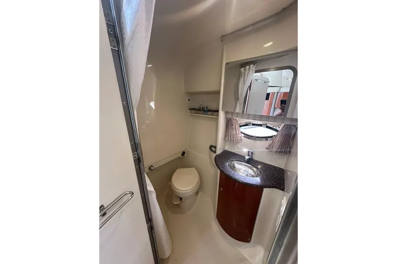 Slide: The Image of 2007 Formula 31 Performance Cruiser bathroom with sink, toilet, and mirror. - 20
