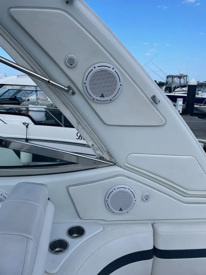 Slide: The Image of 2007 Formula 31 Cruiser interior with speakers and seating, docked at a marina. - 28
