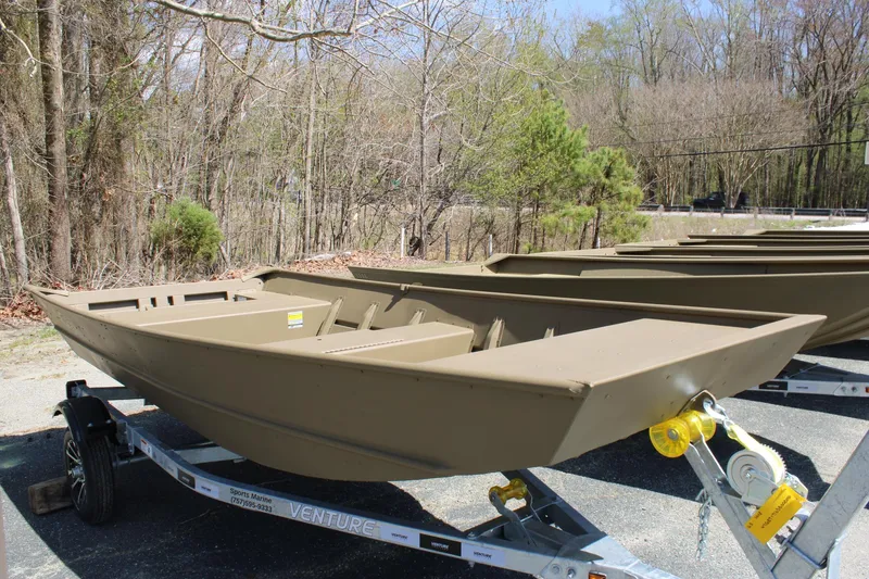 Slide: The Image of 2025 G3 Gator Tough 1448 LW boat on trailer, parked outdoors. - 1