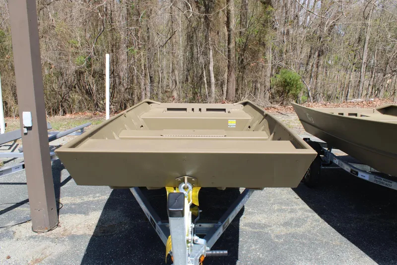 Slide: The Image of 2025 G3 Gator Tough 1448 LW boat on trailer, parked outdoors. - 2