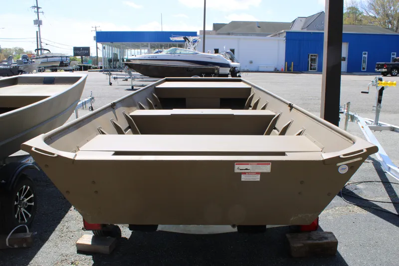 Slide: The Image of 2025 G3 Gator Tough 1448 LW boat displayed outdoors at a dealership. - 3