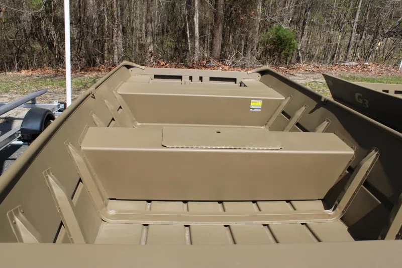 Slide: The Image of 2025 G3 Gator Tough 1448 LW boat interior with bench seats, outdoors. - 5