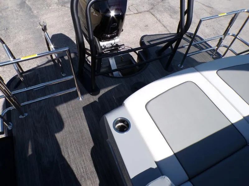 Slide: The Image of 2025 Godfrey AquaPatio 255 SFL boat deck with seating and motor. - 14