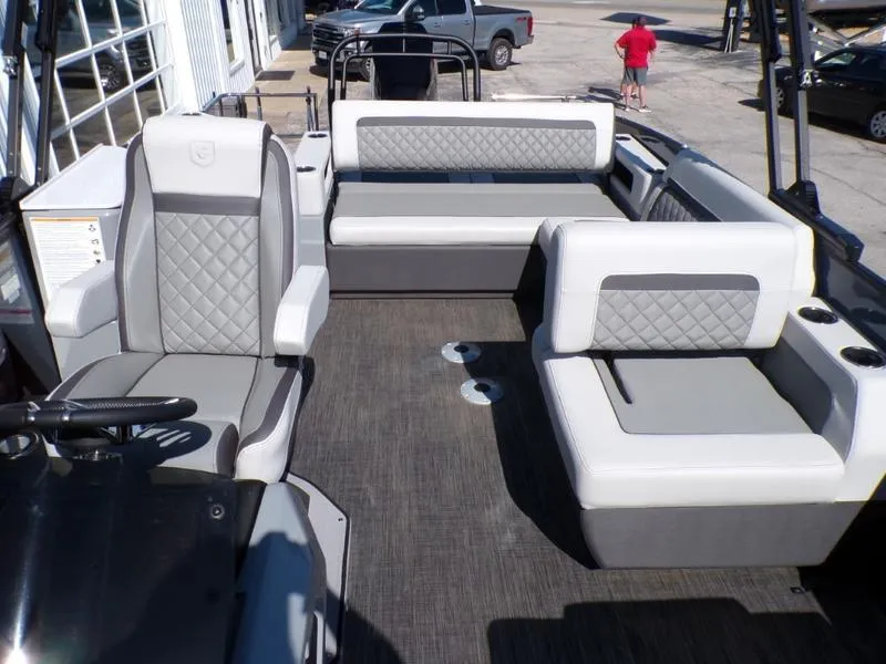 Slide: The Image of 2025 Godfrey AquaPatio 255 SFL iMPACT pontoon boat interior with gray seating and modern design. - 15