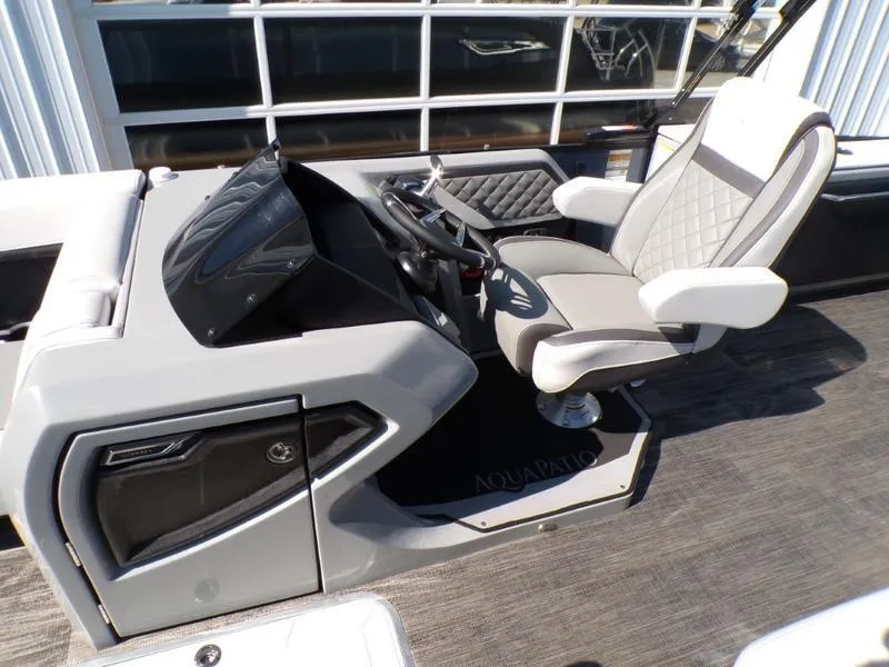 Slide: The Image of Captain's seat and helm of 2025 Godfrey AquaPatio 255 SFL boat, featuring modern design. - 3