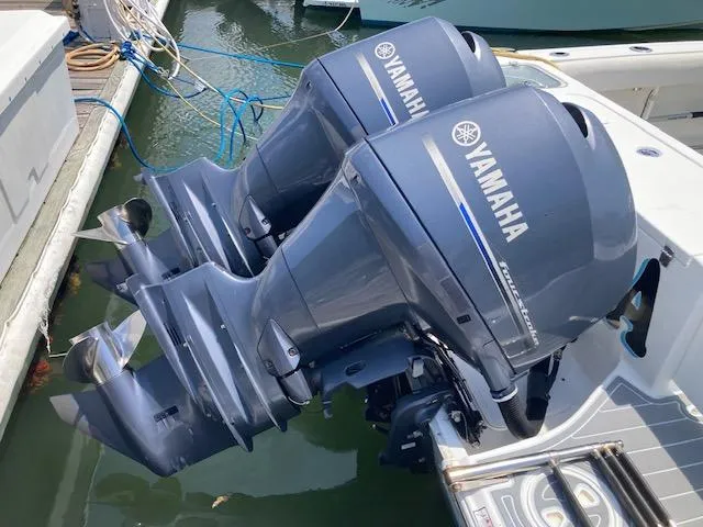 Slide: The Image of Twin Yamaha outboard motors on a 2014 Sea Hunt Gamefish 27 boat. - 11