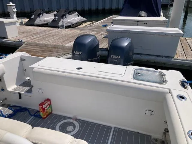Slide: The Image of 2014 Sea Hunt Gamefish 27 boat with twin 150 engines docked at marina. - 18