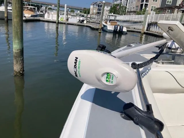 Slide: The Image of 2014 Sea Hunt Gamefish 27 with Minn Kota trolling motor at marina dock. - 19