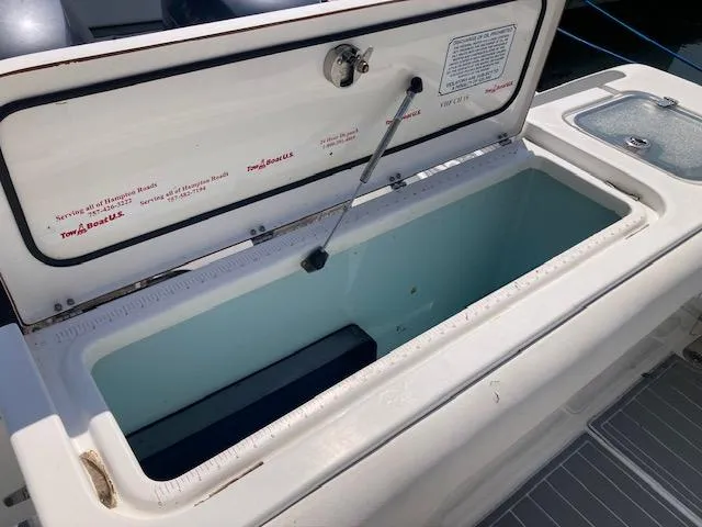 Slide: The Image of Open storage compartment on a 2014 Sea Hunt Gamefish 27 boat. - 20