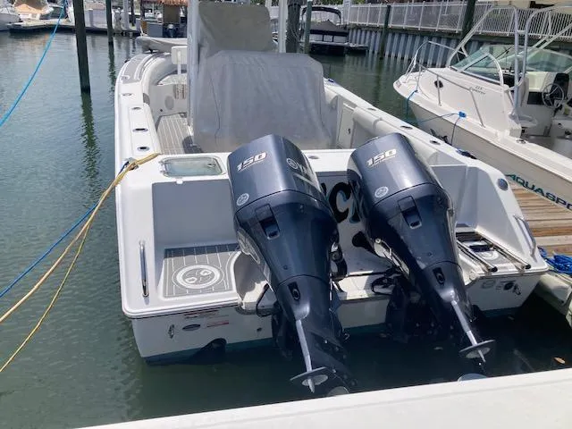 Slide: The Image of 2014 Sea Hunt Gamefish 27 with twin 150 HP engines docked at marina. - 6