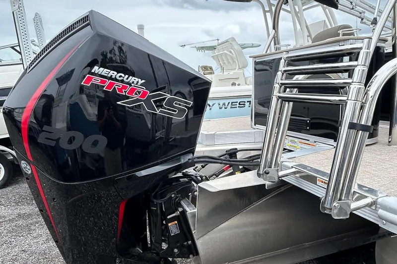 Slide: The Image of 2024 Tahoe Pontoon 2385 TZ with Mercury Pro XS 200 engine, featuring a sleek design. - 16