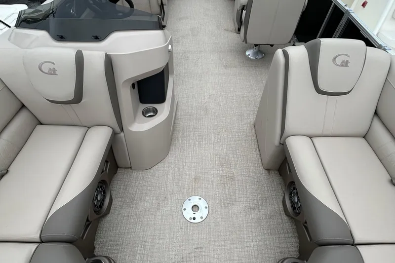 Slide: The Image of 2024 Tahoe Pontoon 2385 TZ interior with beige seating and modern design. - 18