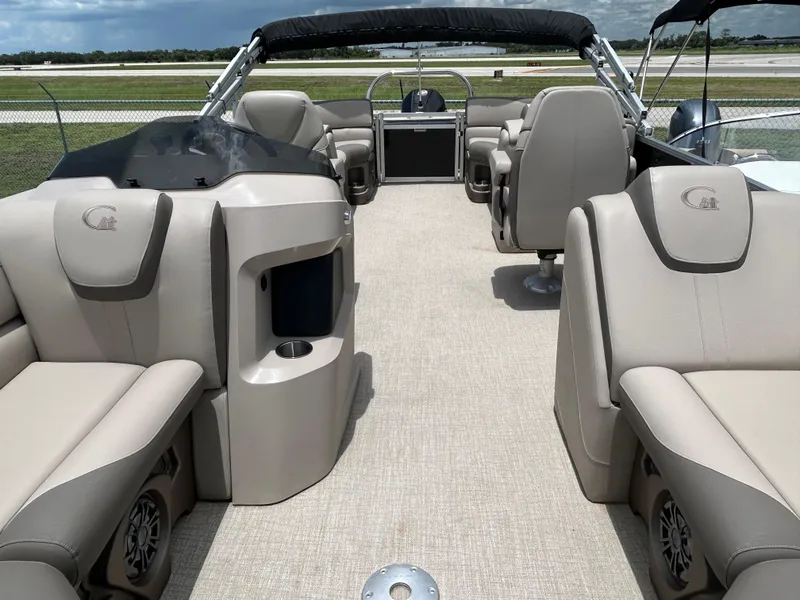 Slide: The Image of 2024 Tahoe Pontoon 2385 TZ interior with luxurious seating and modern design. - 26