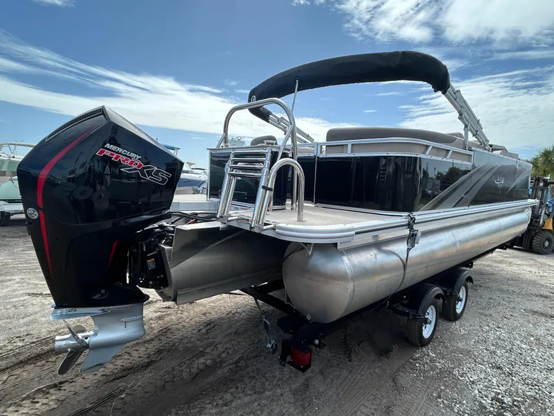 Slide: The Image of 2024 Tahoe Pontoon 2385 TZ with Mercury Pro XS engine on trailer. - 5