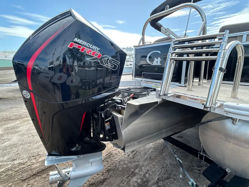 Slide: The Image of 2024 Tahoe Pontoon 2385 TZ with Mercury Pro XS 200 engine, docked outdoors. - 8