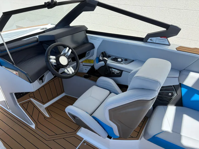 Slide: The Image of 2026 Nautique Super Air Nautique G21 cockpit with modern steering and seating. - 10