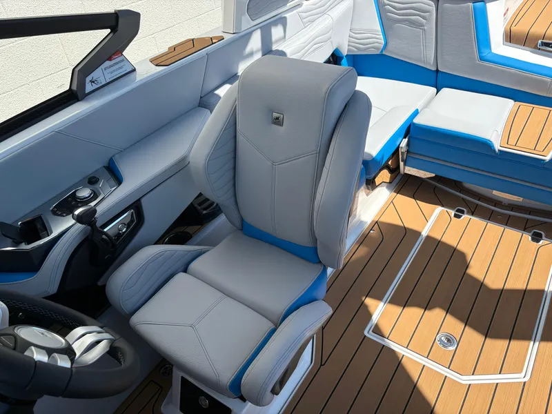 Slide: The Image of 2026 Nautique Super Air Nautique G21 interior with luxurious seating and modern controls. - 11