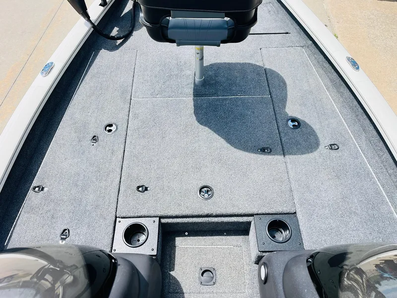 Slide: The Image of 2024 Tracker Pro Team 175 TXW boat deck with seating and storage compartments. - 10
