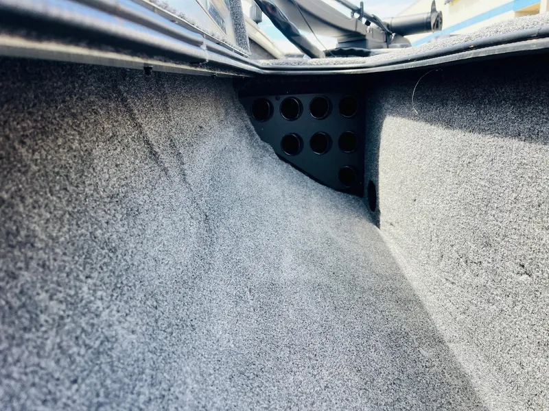 Slide: The Image of Interior view of 2024 Tracker Pro Team 175 TXW boat storage compartment. - 13