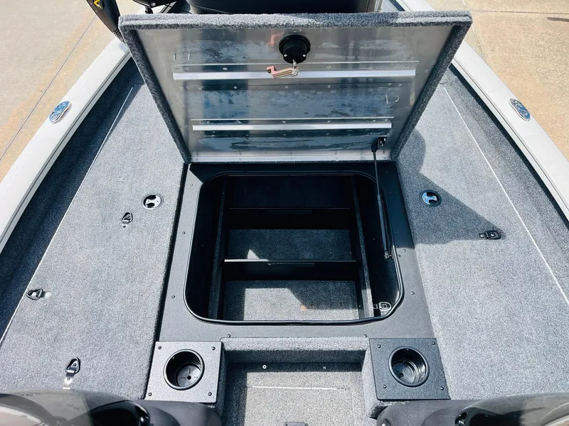 Slide: The Image of 2024 Tracker Pro Team 175 TXW boat storage compartment open, showcasing interior space. - 14