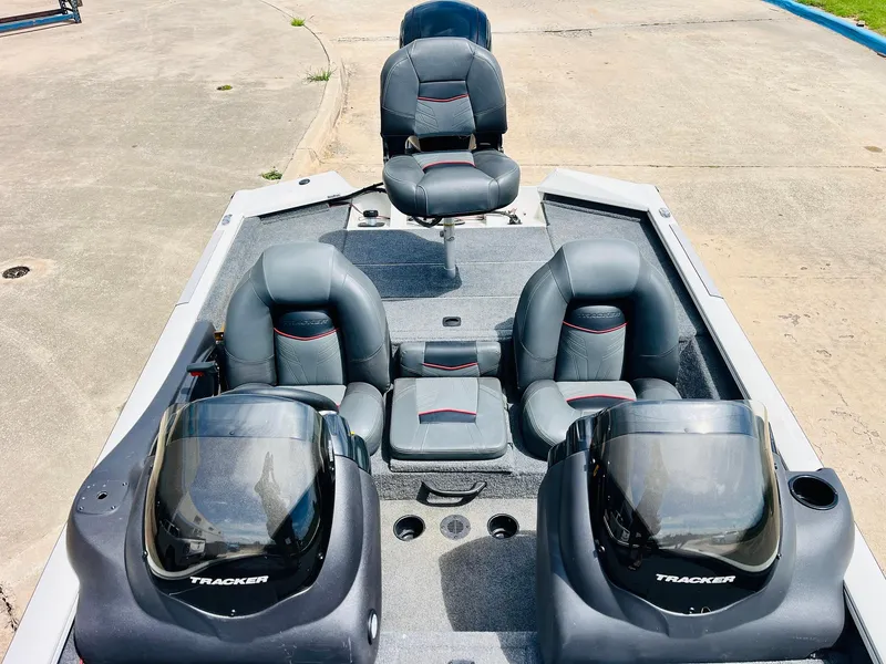 Slide: The Image of 2024 Tracker Pro Team 175 TXW boat interior with seating and consoles. - 19