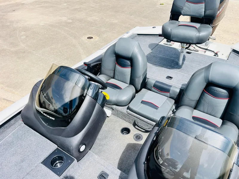Slide: The Image of 2024 Tracker Pro Team 175 TXW boat interior with gray seating and dual consoles. - 21