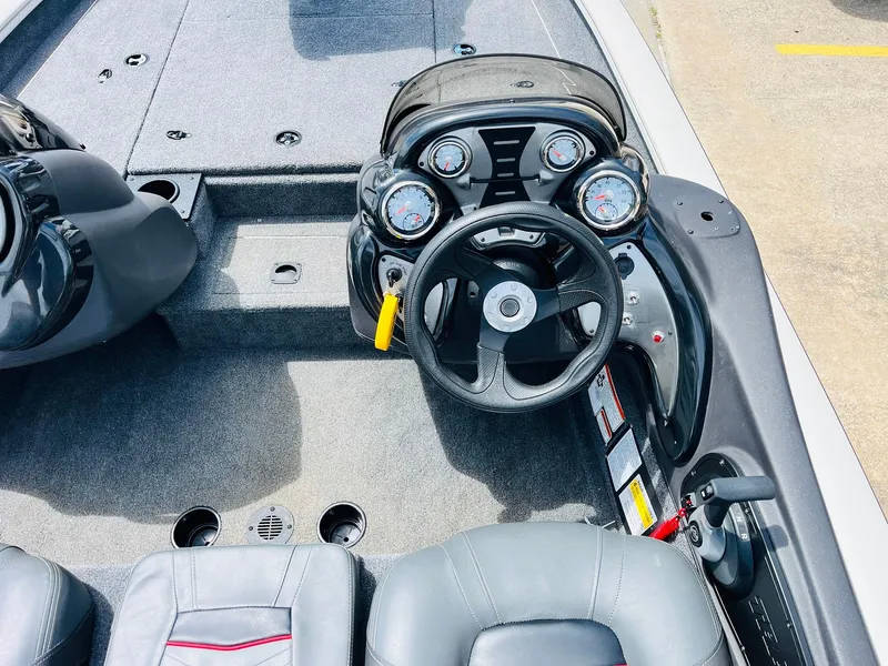 Slide: The Image of 2024 Tracker Pro Team 175 TXW boat cockpit with steering wheel and gauges. - 24