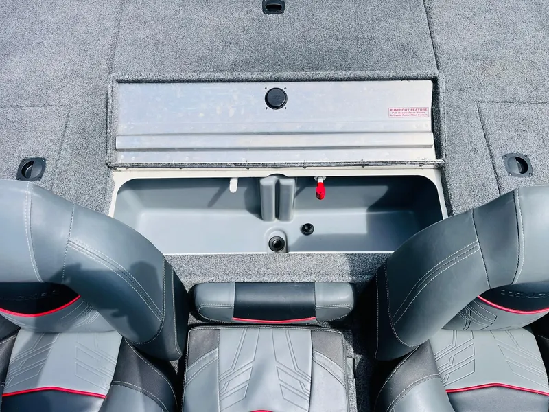 Slide: The Image of 2024 Tracker Pro Team 175 TXW boat interior with storage compartment and seating. - 27