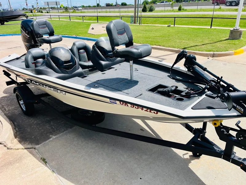 Slide: The Image of 2024 Tracker Pro Team 175 TXW fishing boat on trailer, parked outdoors. - 3